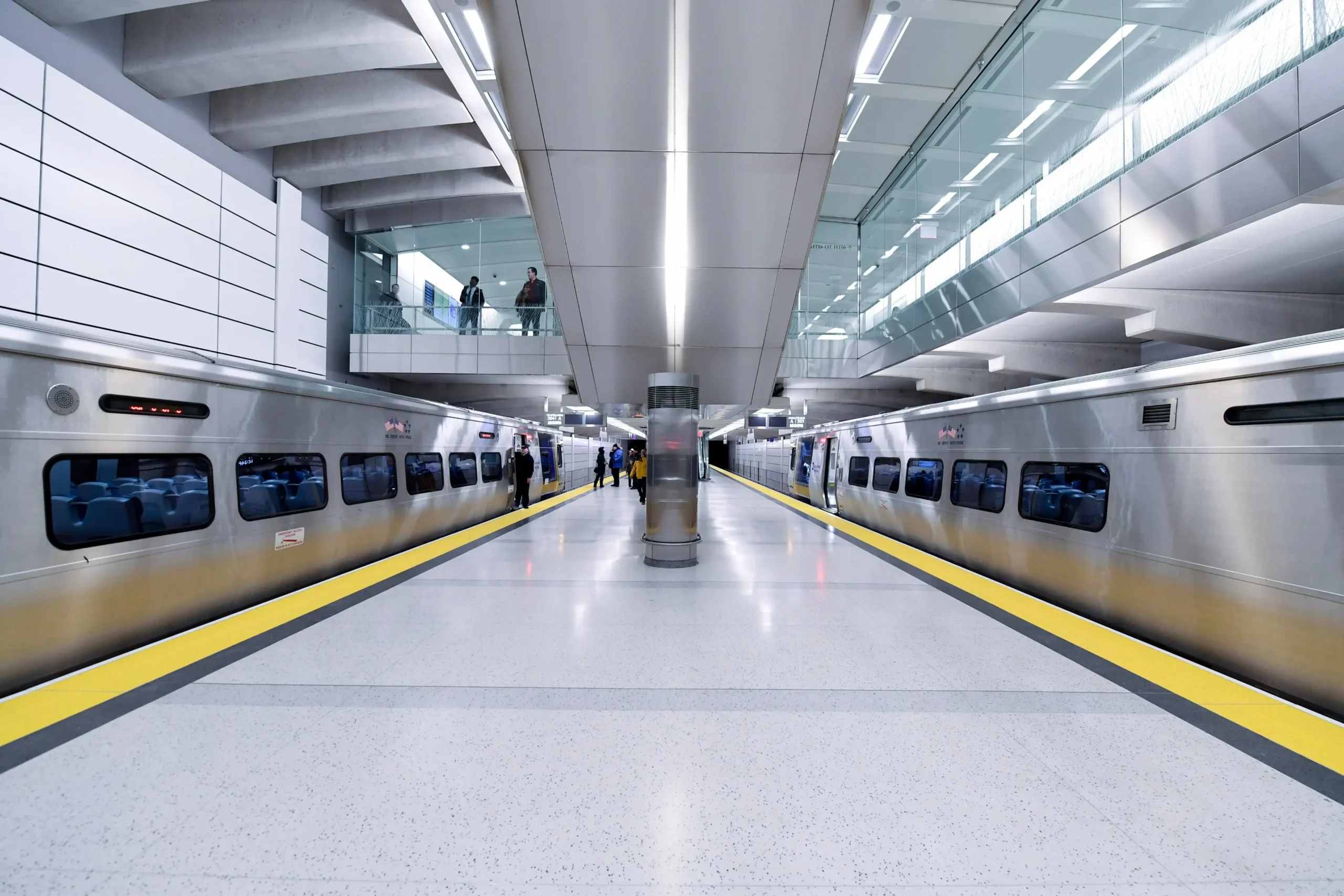 A subway train is parked in a subway station.