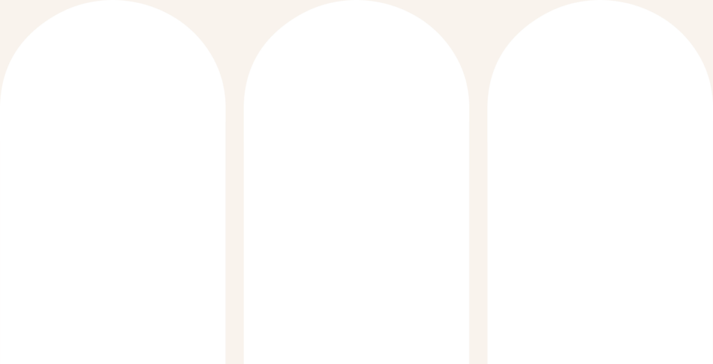 Three black skateboards in a row on a white background.