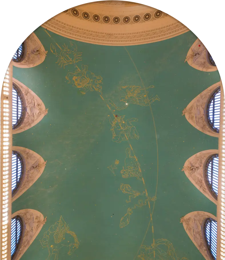 The ceiling of a building with an ornate design.