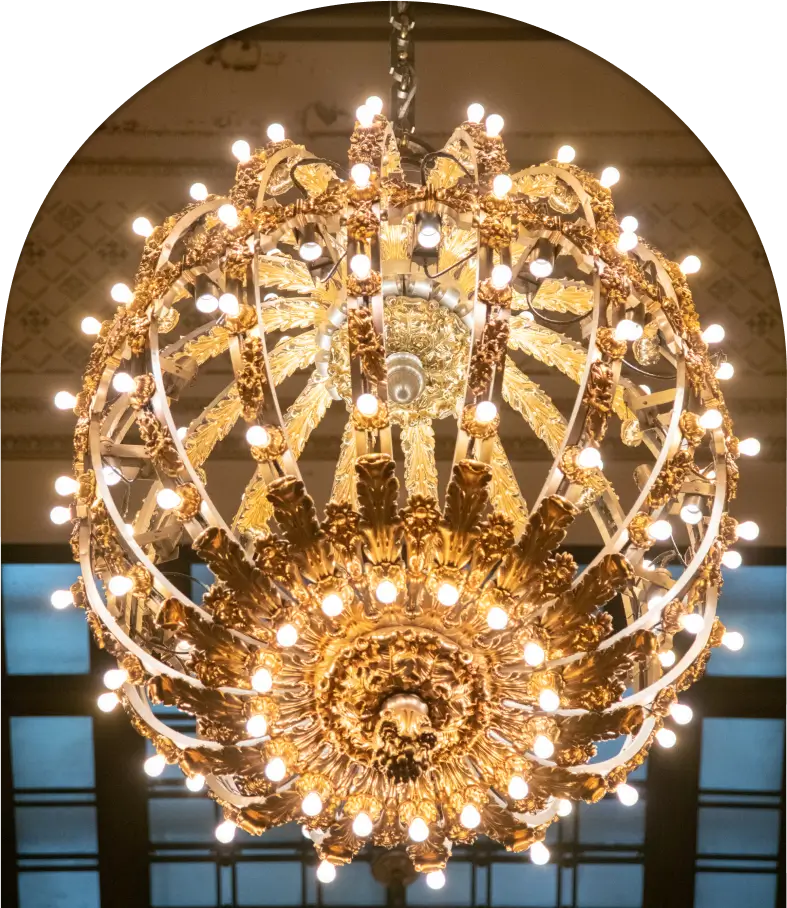 A large chandelier with many lights hanging from it.
