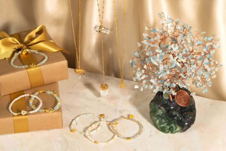 A gift box with a necklace, earrings, and bracelets.