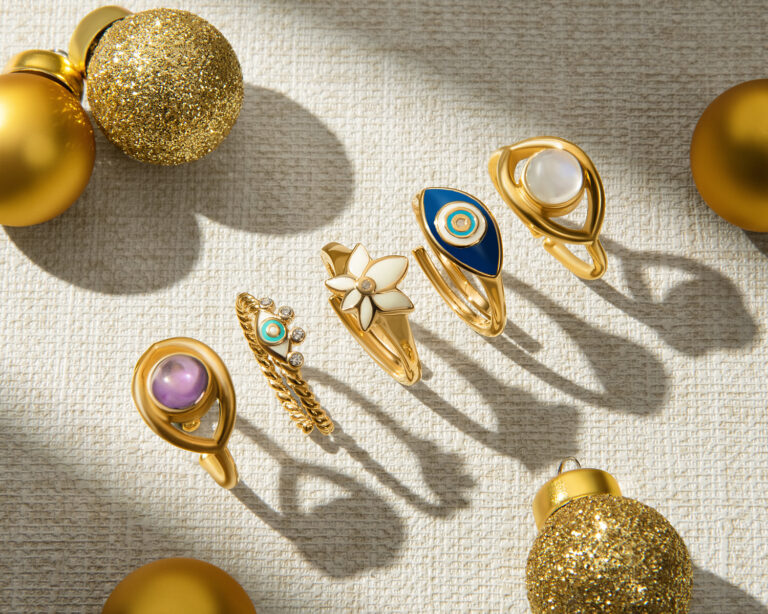A collection of gold rings and ornaments on a table.