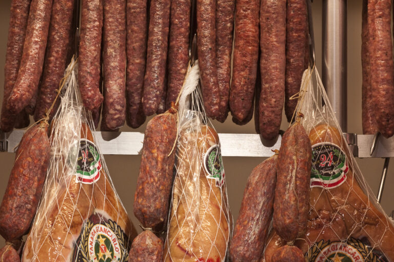A rack of sausages hanging on a rack.