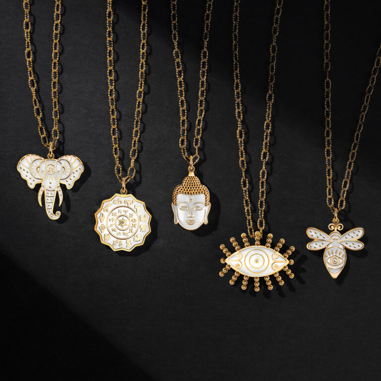 Four gold necklaces with a buddha on them.