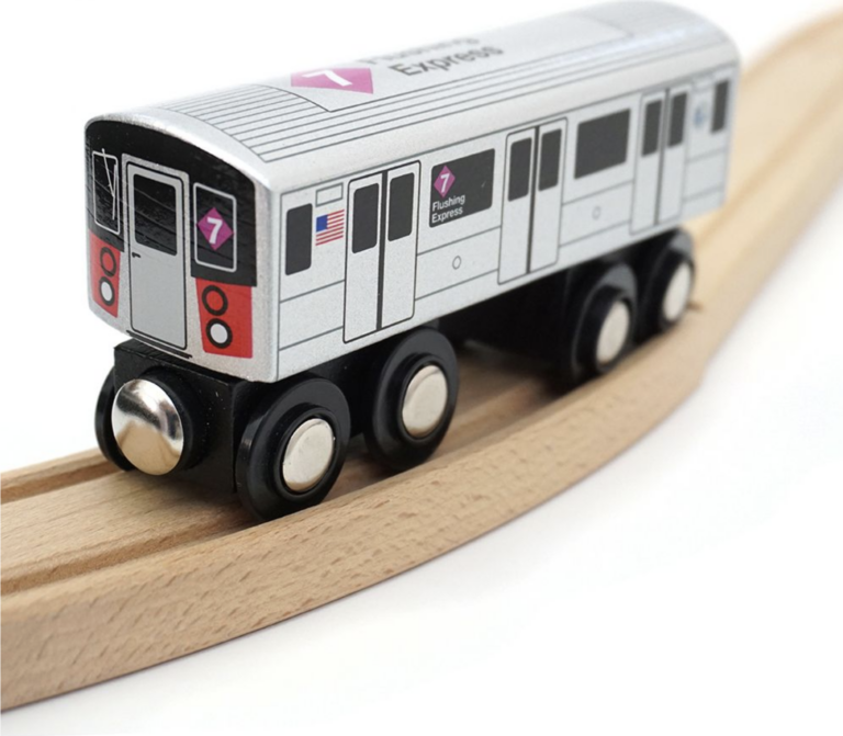 A toy train on a wooden track.