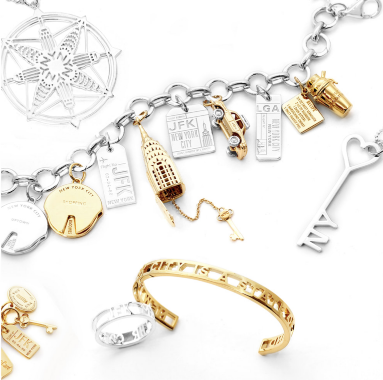 A collection of gold and silver charms on a white background.