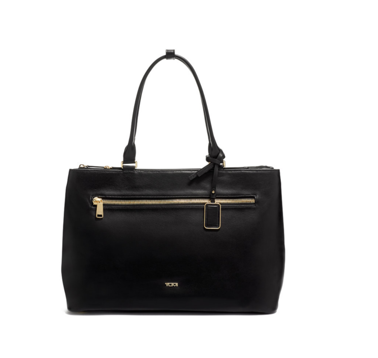 A black leather tote bag with gold zippers.