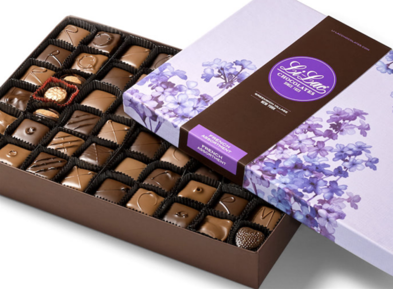 A box of chocolates in a purple box.