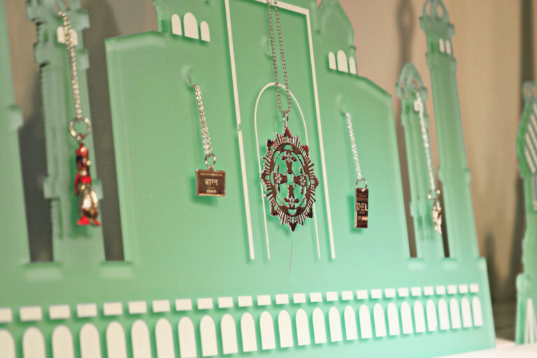A display of necklaces on a shelf.