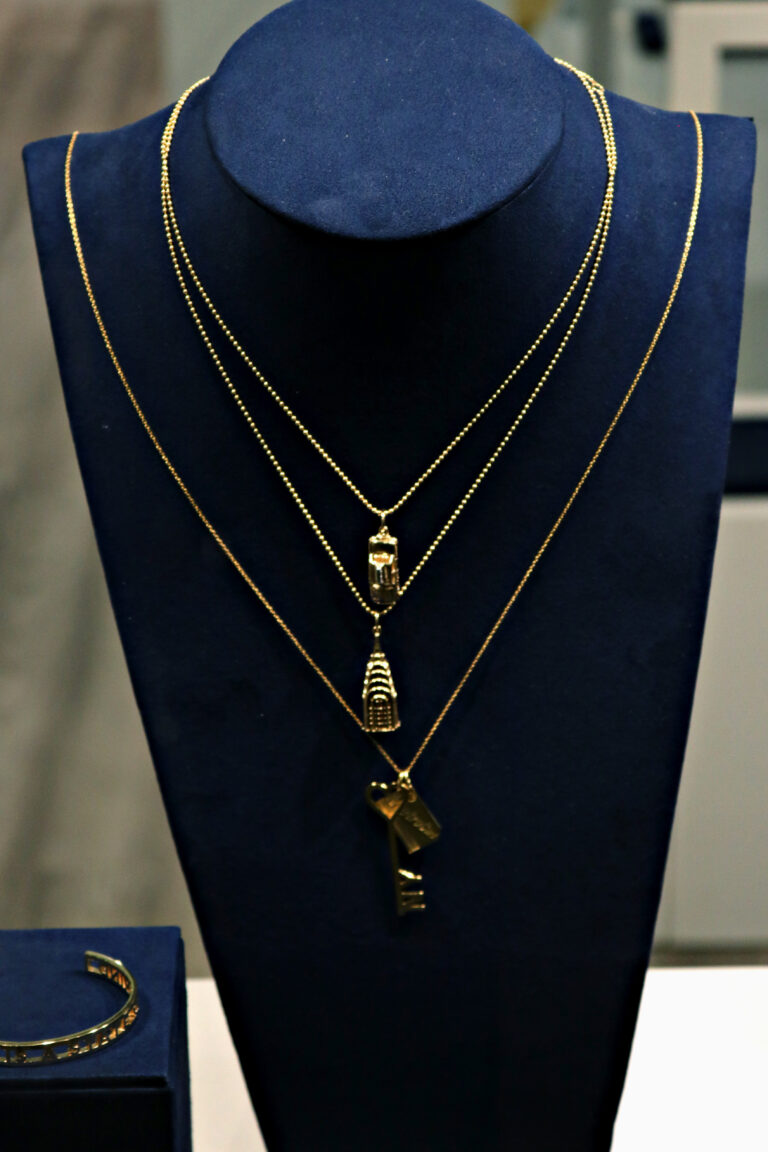 A display of necklaces and bracelets on a mannequin.